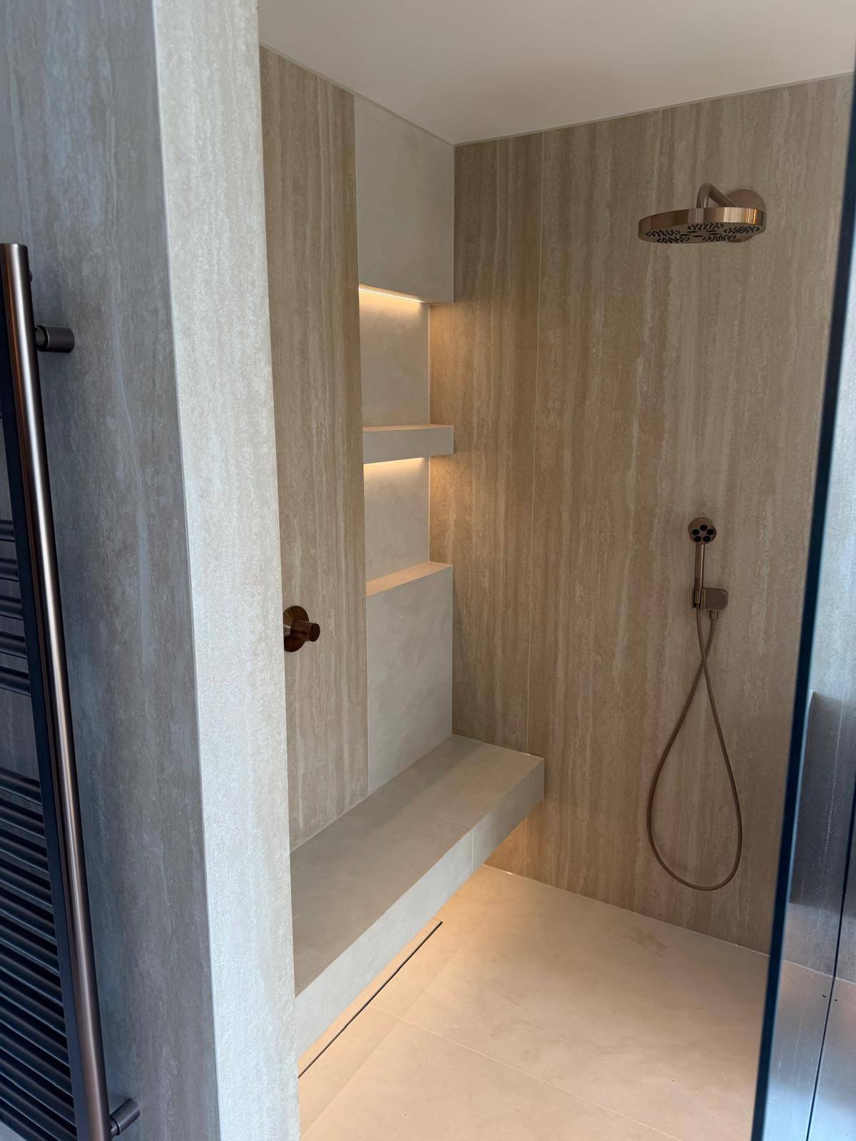 Wet room with stone walling and bench sealed against the floor
